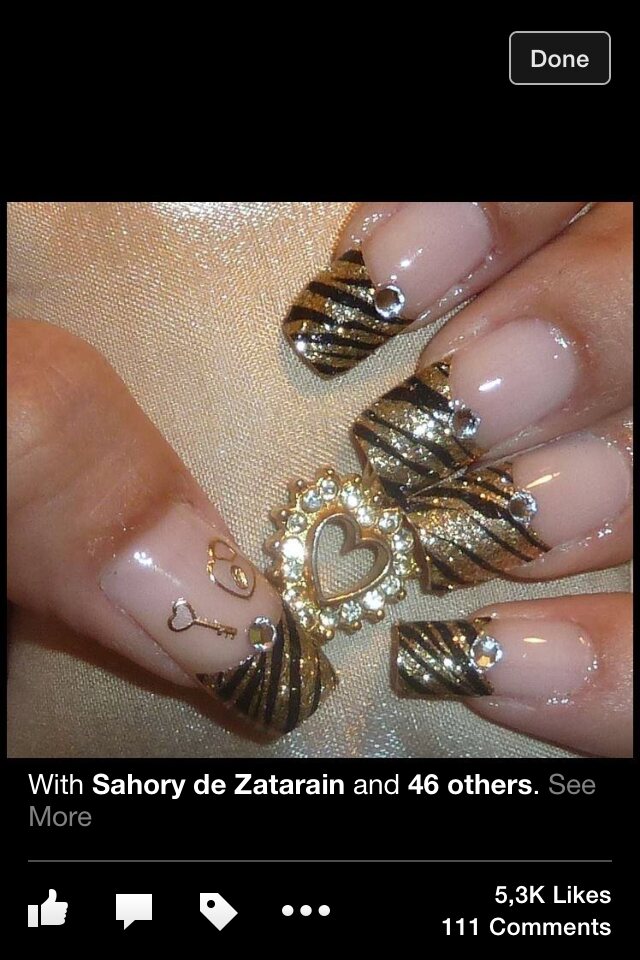 Sculpted gold statement nail art